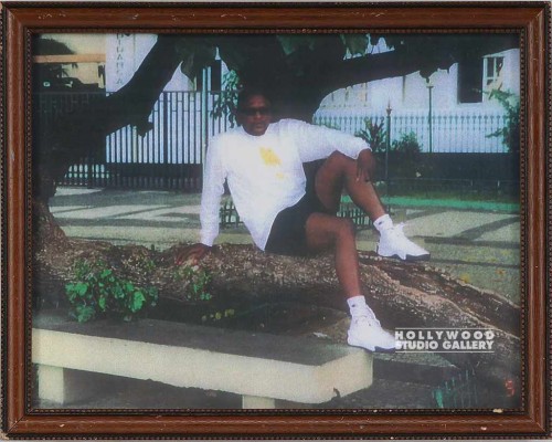 9X12 BLACK MAN SITTING ON TREE