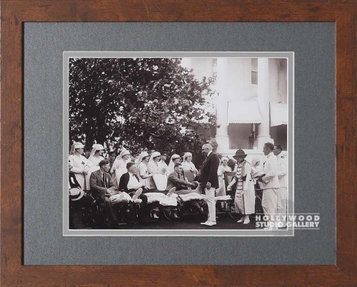 13X16 B W PHTO MEN ON WHEEL CHRS