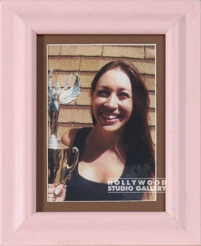 9X7 TABLETOP LADY HOLDING TROPHY