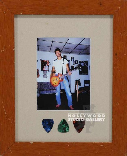 13X10 GUY HOLDING GUITAR/ 3 PICKS