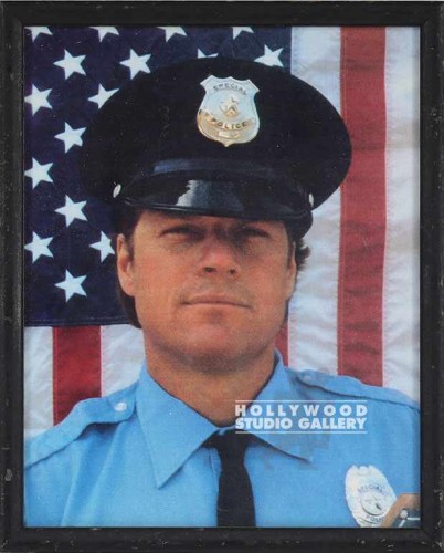 10X8 OFFICER IN FRONT OF USA FLAG