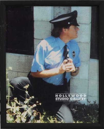 10X8 OFFICER HOLDING WEAPON