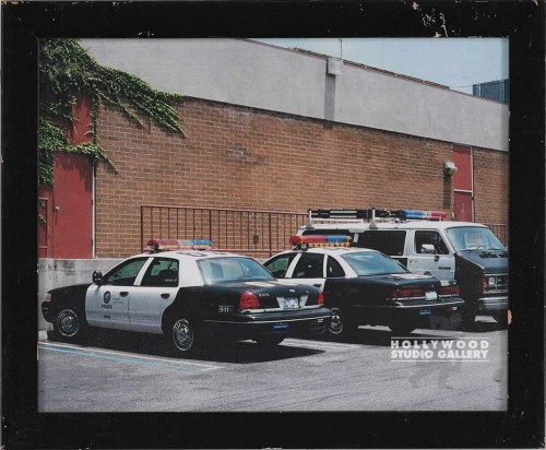 8X10" 2 POLICE CARS PARKED BY WALL